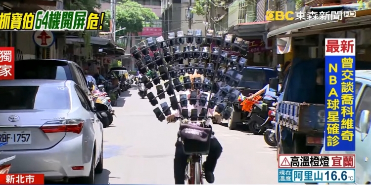 宝可梦阿伯“进化” 64部手机同时玩Pokemon Go！